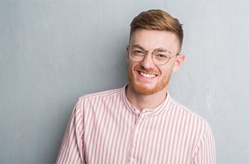 A man smiling with bright teeth