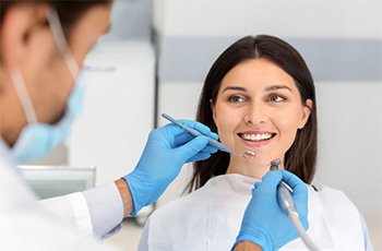 A patient undergoing a dental checkup and cleaning