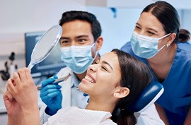 Patient in McAlpine smiling after cosmetic dentistry